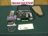 7390 Sig SauerC 3 45 acp, 4.2 inch barrel,Crimsom trace lazer, nite sites, 2 mages Rose wood grips, AS NEW IN CASE. shot less than a box, gun rug, c - 1 of 11
