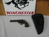 7584 Colt
PYTHON 357 mag 6 inch barrel red ramp front site, rug, white outline rear adjustable,walnut checkered grips with medallion, mfg 1985 s/ - 1 of 12
