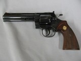 7584 Colt
PYTHON 357 mag 6 inch barrel red ramp front site, rug, white outline rear adjustable,walnut checkered grips with medallion, mfg 1985 s/ - 2 of 12