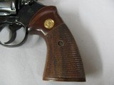 7584 Colt
PYTHON 357 mag 6 inch barrel red ramp front site, rug, white outline rear adjustable,walnut checkered grips with medallion, mfg 1985 s/ - 3 of 12