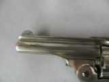7589 Iver Johnson Arms and Cycle Works 38 smith/wesson caliber 3.25 barrel,top open, nickel 95%, box is poor condition, shells inside are poor condiit - 7 of 12