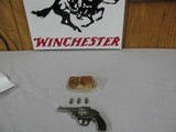 7589 Iver Johnson Arms and Cycle Works 38 smith/wesson caliber 3.25 barrel,top open, nickel 95%, box is poor condition, shells inside are poor condiit - 1 of 12