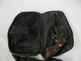 7588 Smith Wesson19-2, 357 Mag 4 inch barrels white outline rear adjustable site, front ramp, drag line, 97% condition, leather holster/pouch carryi - 2 of 10