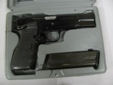 7633 Browning HI Power 9mmmade in Belguim assembled in Portugal, 3 magazines holds 13 rounds each, Crimson trace lazer in grips, original grips incl - 2 of 12