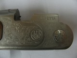 7700 Beretta Silver Pigeon I 20
gauge 28 inch barrel 99% condition, AS NEW IN CASE ,5 chokes, sk ic mod im ful wrench, booklets, coin silver engraved - 9 of 15