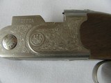 7700 Beretta Silver Pigeon I 20
gauge 28 inch barrel 99% condition, AS NEW IN CASE ,5 chokes, sk ic mod im ful wrench, booklets, coin silver engraved - 6 of 15