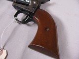 7786
Colt Single Action Buntline Scout, 22 MAG, Wood Grips, Case Coloring, MFG 1970 - 2 of 11