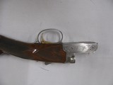 7809
Winchester 23 Golden Quail 410 ga 26 inch barrels mod/full straight grip, ejectors,solid
rib,quail and dog engraved on coin silver receiver, Wi - 5 of 14