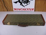 7816Winchester green shotgun case with leather trim, red interior, with keys, 26