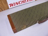 7816
Winchester green shotgun case with leather trim, red interior, with keys, 26