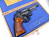 7943Smith and Wesson25-5, 45 Long Colt, Goncalo Alves Grips, Blue Finish 4” Barrell, Wood Presentation Case with Tools, Blemish on Side Plate See - 2 of 15