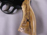 7963
Smith and Wesson K-22
22LR, Adjustable Rear Sight, Fake Stag Grips, Comes with the original Wood Smith and Wesson Grips, 4 inch barrel - 6 of 11
