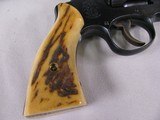 7963
Smith and Wesson K-22
22LR, Adjustable Rear Sight, Fake Stag Grips, Comes with the original Wood Smith and Wesson Grips, 4 inch barrel - 2 of 11