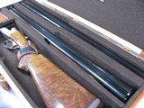7997
SKB 385 Ducks Unlimited set, Only 200 were Made, 20/28 Ga, The stock is C-grade American walnut in high gloss finish with a semi-beavertail fore - 18 of 20