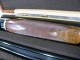 7997
SKB 385 Ducks Unlimited set, Only 200 were Made, 20/28 Ga, The stock is C-grade American walnut in high gloss finish with a semi-beavertail fore - 15 of 20