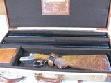 7997
SKB 385 Ducks Unlimited set, Only 200 were Made, 20/28 Ga, The stock is C-grade American walnut in high gloss finish with a semi-beavertail fore - 2 of 20