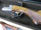 7997
SKB 385 Ducks Unlimited set, Only 200 were Made, 20/28 Ga, The stock is C-grade American walnut in high gloss finish with a semi-beavertail fore - 5 of 20