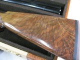 7997
SKB 385 Ducks Unlimited set, Only 200 were Made, 20/28 Ga, The stock is C-grade American walnut in high gloss finish with a semi-beavertail fore - 3 of 20