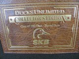 7997
SKB 385 Ducks Unlimited set, Only 200 were Made, 20/28 Ga, The stock is C-grade American walnut in high gloss finish with a semi-beavertail fore - 17 of 20