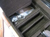 7997
SKB 385 Ducks Unlimited set, Only 200 were Made, 20/28 Ga, The stock is C-grade American walnut in high gloss finish with a semi-beavertail fore - 19 of 20