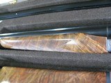 7997
SKB 385 Ducks Unlimited set, Only 200 were Made, 20/28 Ga, The stock is C-grade American walnut in high gloss finish with a semi-beavertail fore - 11 of 20