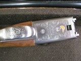 7997
SKB 385 Ducks Unlimited set, Only 200 were Made, 20/28 Ga, The stock is C-grade American walnut in high gloss finish with a semi-beavertail fore - 9 of 20