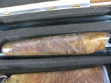 7997
SKB 385 Ducks Unlimited set, Only 200 were Made, 20/28 Ga, The stock is C-grade American walnut in high gloss finish with a semi-beavertail fore - 13 of 20