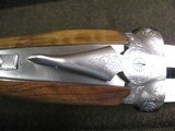7997
SKB 385 Ducks Unlimited set, Only 200 were Made, 20/28 Ga, The stock is C-grade American walnut in high gloss finish with a semi-beavertail fore - 10 of 20