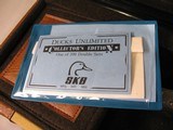 7997
SKB 385 Ducks Unlimited set, Only 200 were Made, 20/28 Ga, The stock is C-grade American walnut in high gloss finish with a semi-beavertail fore - 20 of 20