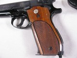 8018Smith and Wesson 39-2 9MM Auto, 8 Shot Magazine, 4 “ Barrel, Checkered walnut grips, MFG 1971, Includes Box not numbered to the gun, It also has - 7 of 12