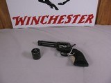 8023 Colt Peacemaker 22LR./WMR, 4.4” barrel, MFG 1974 with dual cylinders. Black eagle grips excellent condition - 1 of 11