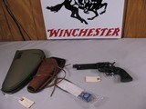 8041
Colt Cowboy SAA 45 LC, 5 1/2 Barrel, MFG 2000, Black Eagle grips, Blue/ Case Color.
92% Blue, Gun shows some holstering and cylinder wear with