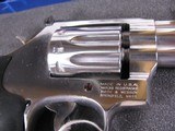 8043Smith and Wesson Model 617 22 LR, Round K Frame, Stainless steel, original Hougue rubber grips, 10 shot fluted cylinder, includes factory case a - 6 of 11