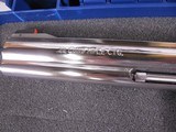 8043Smith and Wesson Model 617 22 LR, Round K Frame, Stainless steel, original Hougue rubber grips, 10 shot fluted cylinder, includes factory case a - 4 of 11