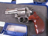 8045
Smith and Wesson Model 686 plus Deluxe 357 Magnum, stainless steel, 7 shot cylinder, 3” full underplug barrel, red ramp front sight, white outli - 2 of 10