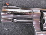 8045
Smith and Wesson Model 686 plus Deluxe 357 Magnum, stainless steel, 7 shot cylinder, 3” full underplug barrel, red ramp front sight, white outli - 5 of 10