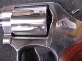 8045
Smith and Wesson Model 686 plus Deluxe 357 Magnum, stainless steel, 7 shot cylinder, 3” full underplug barrel, red ramp front sight, white outli - 4 of 10