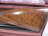 8087
Winchester 23 Grand Canadian 20 GA, 2 3/4 and 3 “. 26” barrels, IC/MOD, 14 1/4 LOP, Winchester pad, AAA+ Fancy Feather Crotch Walnut. Straight G - 10 of 23