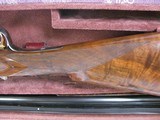 8087
Winchester 23 Grand Canadian 20 GA, 2 3/4 and 3 “. 26” barrels, IC/MOD, 14 1/4 LOP, Winchester pad, AAA+ Fancy Feather Crotch Walnut. Straight G - 11 of 23