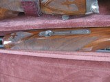 8087
Winchester 23 Grand Canadian 20 GA, 2 3/4 and 3 “. 26” barrels, IC/MOD, 14 1/4 LOP, Winchester pad, AAA+ Fancy Feather Crotch Walnut. Straight G - 17 of 23