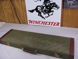 8092
Winchester
101 or 23 Hard trunk luggage style case. Red interior, keys, hang tags, and 2 blocks. Will take up to 30 1/2 “ Barrels.