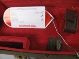 8092
Winchester
101 or 23 Hard trunk luggage style case. Red interior, keys, hang tags, and 2 blocks. Will take up to 30 1/2 “ Barrels. - 9 of 12