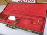8092
Winchester
101 or 23 Hard trunk luggage style case. Red interior, keys, hang tags, and 2 blocks. Will take up to 30 1/2 “ Barrels. - 8 of 12
