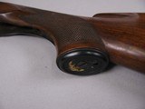 8107
Winchester Model 21 12 Gauge wood stock, woods length is 14 1/2”, with the leather pad the length is 15”, pistol grip, nice figured wood. - 4 of 11