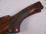 8107
Winchester Model 21 12 Gauge wood stock, woods length is 14 1/2”, with the leather pad the length is 15”, pistol grip, nice figured wood. - 9 of 11