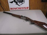 8123
Winchester Super grade 12 gauge over 222 Remington. Only 1000 ever produced, This is number 830. Has bases for scope, Cheak piece, Rose and scro