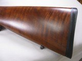8146 Ruger M77 Mark II Compact 257 Roberts, 20” Barrel, Ebony Insert, Ruger Pad, Pistol Grip With cap, Leupold Vari X 3x9, Tiger Stripe, Walnut Stock, - 2 of 13
