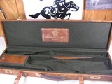 8753
ArmsPort INC. Trunk style hard leather Shotgun case. NEW- Comes with new matching gun socks. Will hold up to 32” Barrels.