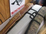 8757Shotgun and rifle cases. Real tree case 52” long, Winchester case 49” and the leather case 50”. Gun case cover …All are in good used condition. - 4 of 5