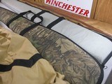 8757
Shotgun and rifle cases. Real tree case 52” long, Winchester case 49” and the leather case 50”. Gun case cover …All are in good used condition. - 2 of 5